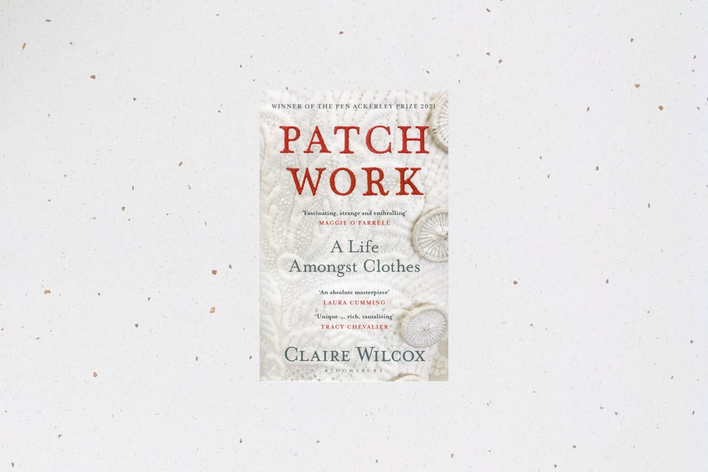 Patch Work: A Life Amongst Clothes by Claire Wilcox, a memoir weaving personal stories with reflections on clothing and textiles.